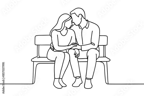 Couple in love sitting on a bench, embracing tenderly with affection and closeness