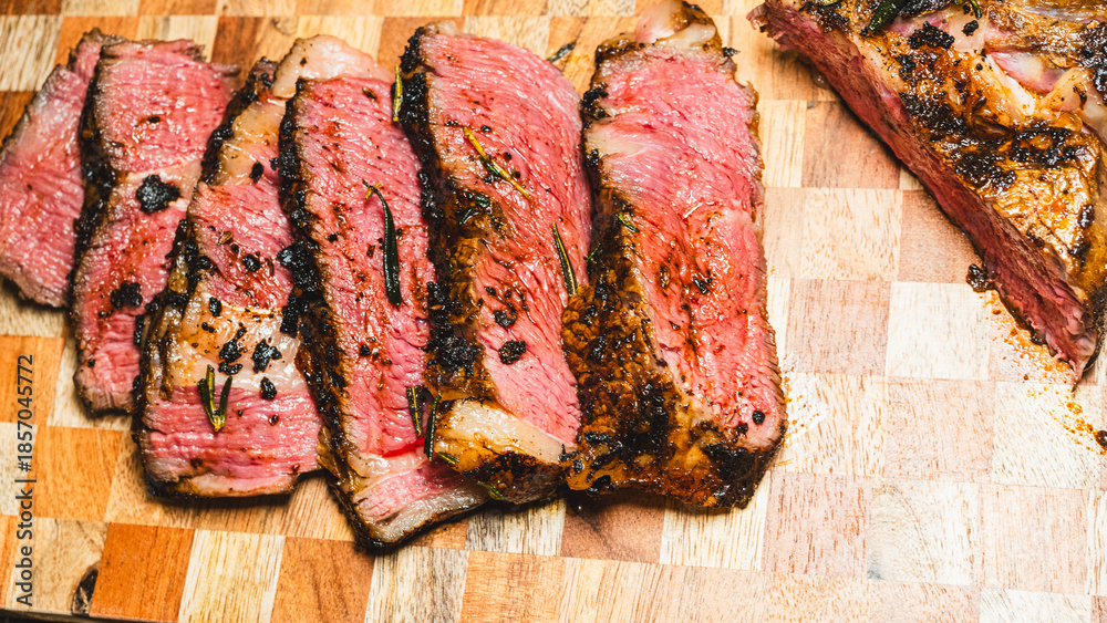 Αυτοκόλλητο Côte de boeuf (Ribeye steak) on a wooden board, perfectly seared with spice rub outside and rare inside