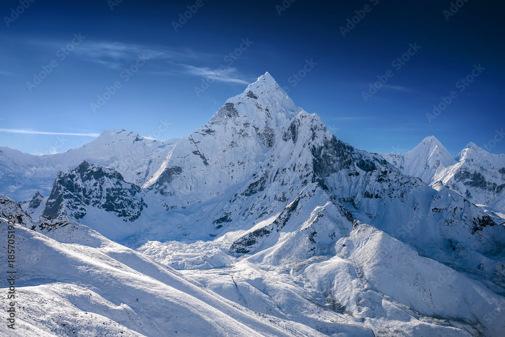 Obraz premium Aerial view of the snowy mount Ama Dablam. Helicopter flight over Himalaya mountains in Khumbu region, Nepal.