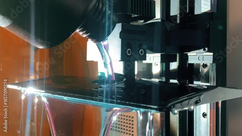 Pouring liquid resin into 3d printer vat before starting SLA printing process