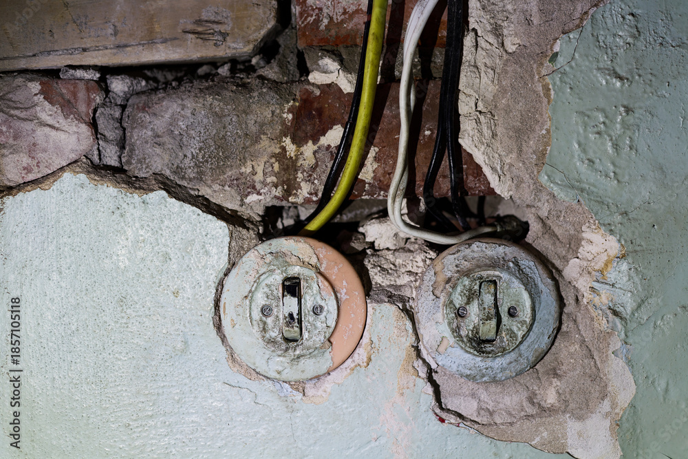 custom made wallpaper toronto digitalVintage Electrical Wiring: Exposed Old Switches and Faulty Wires on Crumbling Plaster Wall in Home Renovation Project Close-up