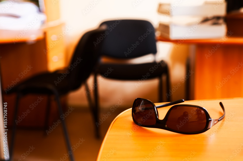 custom made wallpaper toronto digitalInterior Scene: Sunglasses Resting on Wooden Desk in Office with Stacked Files and Empty Chair Background