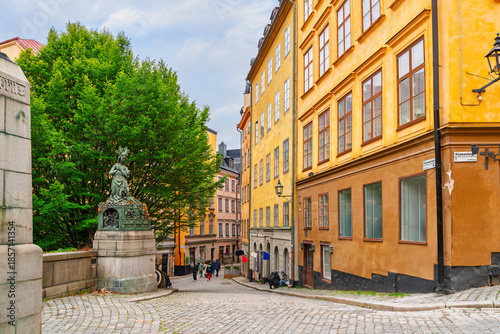 Photography Shops and cafes line the cobblestone streets from Köpmantorget, or Merchant's Square, near the Princess Statue, in Gamla Stan, the old town of Stockholm, Sweden