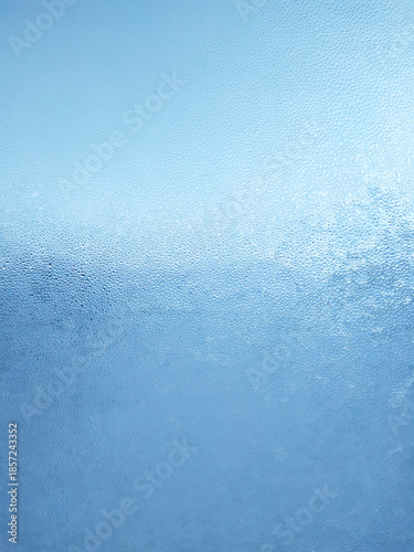 Texture of fogged glass, abstract blue background.