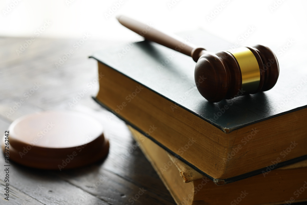 Obraz premium Judges gavel on wooden desk. Law firm concept.