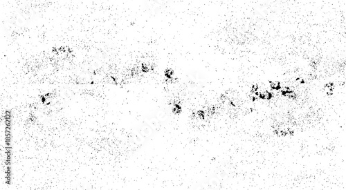 Abstract texture of grunge white and black scratches and cracks, Chaotic grunge ink particles. Abstract texture with grain and stain.