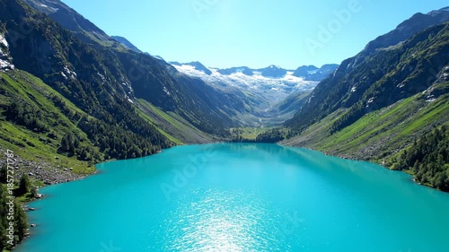 Stunning scenic panorama of Lake Louise in Banff National Park Canada with a beautiful glacier lake reflection against mountains and green forest under a blue sky