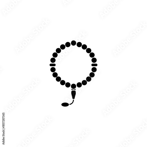 Black rosary beads on forming a circular shape with a tassel