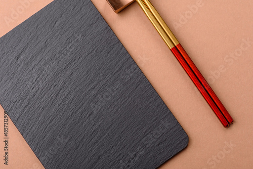 A black slate stone board or plate, an empty kitchen utensil. A black slate board