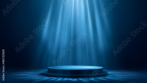 Illuminated circular stage platform bathed in dramatic blue volumetric light beams creating an atmospheric and ethereal presentation backdrop for awards or product launches