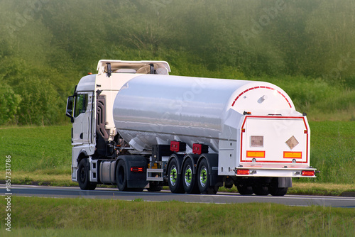 Photos Chemical transport truck moving along rural highway