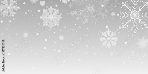 A serene winter background featuring delicate white snowflakes falling gently