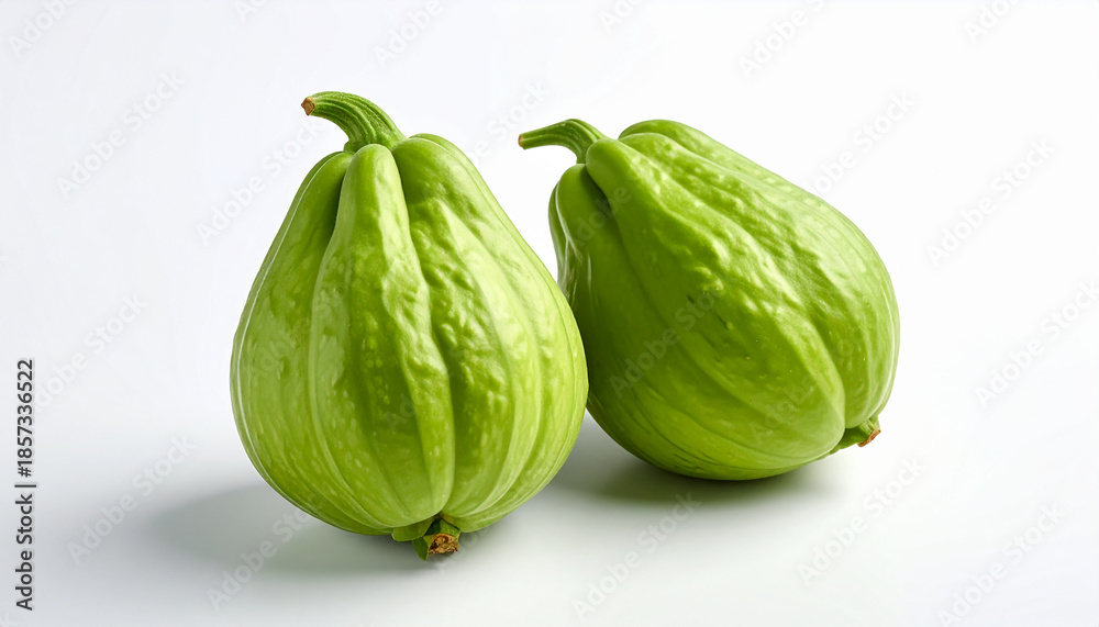 Naklejka premium Two Pear- Shaped Green Chayote Squashes with Stems on White Background vegetable fresh