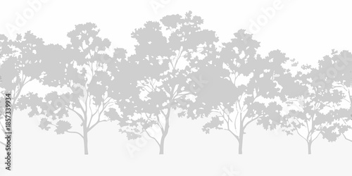A grayscale silhouette of a dense forest with varied tree shapes