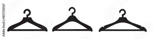 Three black clothes hangers are presented in a clean, minimalist vector style, symbolizing fashion, retail, and wardrobe organization.