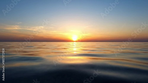 Horizon Glow ocean reflections summer Wide shot, low angle looking across the ocean towards the setting or rising sun Golden hour