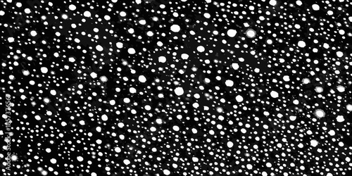 A black and white abstract pattern of scattered irregularly shaped white spots