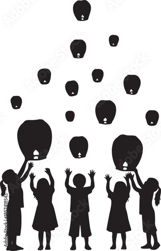 Children releasing sky lanterns into the night sky silhouette