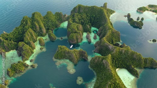 Raja Ampat, Indonesia: Aerial drone footage of the famous Piaynemo viewpoint plateform overlooking a stunning lagoon in the Fam islands in Raja Ampat in west Papua in Indonesia.