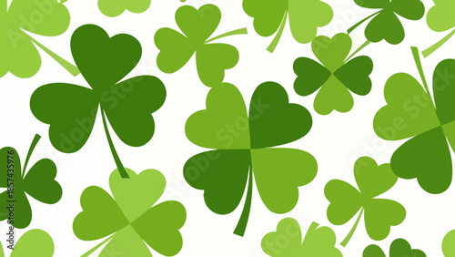 A vibrant pattern of various shades of green shamrocks and four-leaf clovers scattered across a white background, evoking a festive St. Patrick's Day theme.
