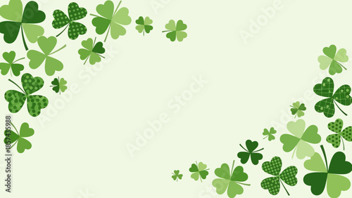 A light green background decorated with various shades of green shamrocks and clovers.