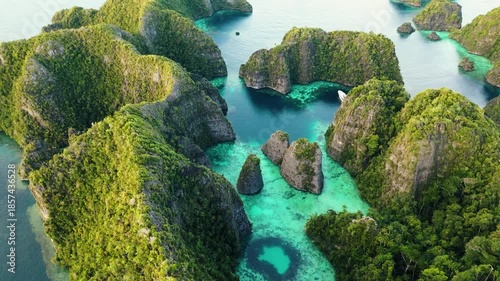 Raja Ampat, Indonesia: Aerial drone footage of the famous Piaynemo viewpoint plateform overlooking a stunning lagoon in the Fam islands in Raja Ampat in west Papua in Indonesia.