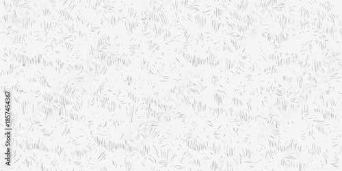 A monochrome image depicting a field of tall textured grass blades