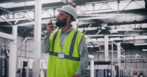Tableau sur toile Engineer Communicating Via Walkie Talkie in Factory