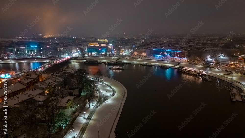 Fototapeta premium Aerial view of Krakow city streets at night in winter
