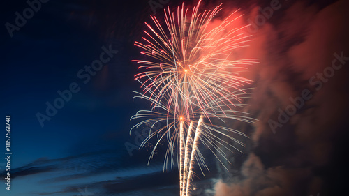 Fireworks Explosion in Vibrant Red and White Colors with Dramatic Smoke at Night for Celebration