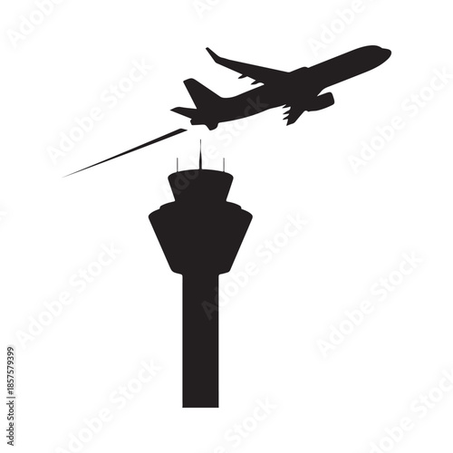 Airplane taking off near an airport control tower in silhouette