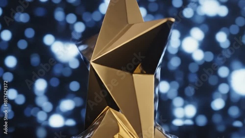 A dazzling golden star trophy, featuring brilliant reflections and spectacular light flares, stands prominently against a dynamic backdrop of shimmering blue bokeh lights. This elegant and prestigious
