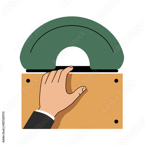 A hand reaching for a green and white arched office tool on a wooden surface.