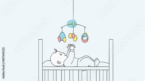 Baby lying in crib reaching for mobile overhead.
