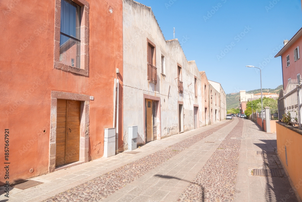 Fototapeta premium Sunlit empty street, Bosa, Italien