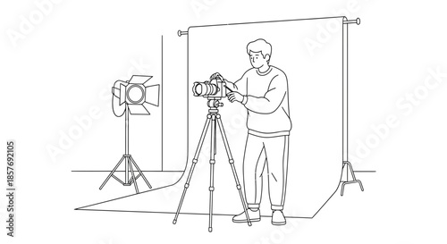 Photographer Adjusting Camera on Tripod in Studio with Lighting