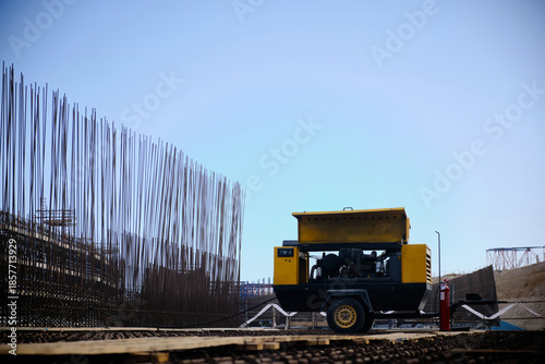 Mobile air compressor at construction site