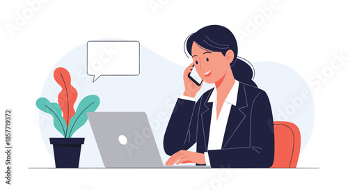 Professional businesswoman in a suit multitasks at her desk, talking on the phone while working on her laptop computer.