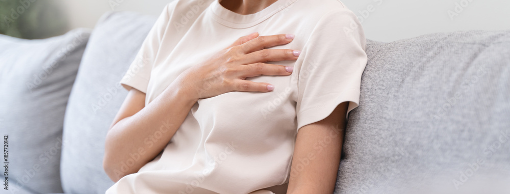 Obraz premium Close-up woman touching chest feeling pain heart attack symptom