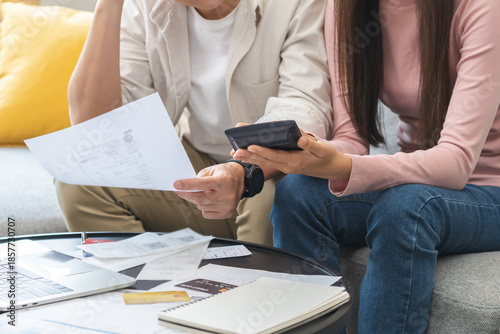 Cuadro en lienzo Stressed financial owe asian young couple love sitting suffer, stressed and confused by calculate expense from credit card bill, no money to pay, mortgage or loan