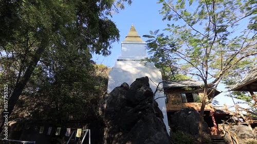 Aerial video view from a high mountain overlooking a beautiful tourist attraction in Lampang, Thailand Wat Chalerm Phra Kiat (Wat Phra Phutthabat Sutthawas),featuring an ancient pagoda and a nature.