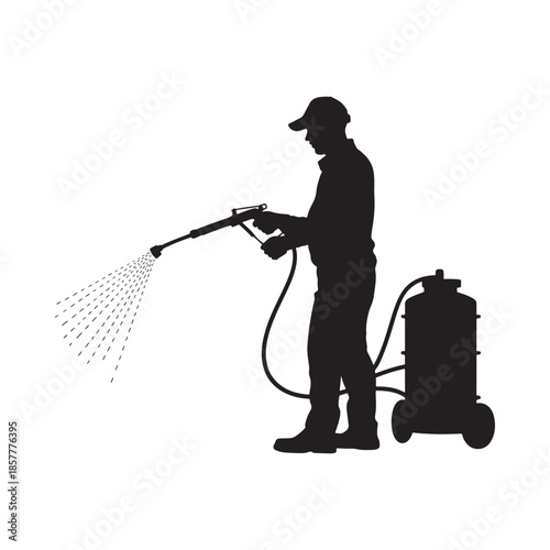 A silhouette of a worker using a sprayer with a tank on wheels outdoors