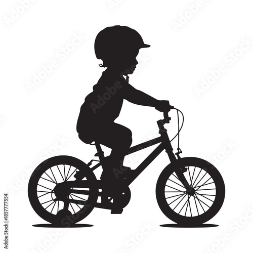 A silhouette of a young child happily riding a bicycle showcasing freedom and childhood joy