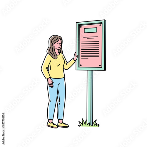 Woman reading informational sign while standing in grass outdoors  