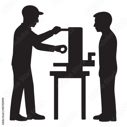 Skilled mechanic demonstrates machine operation to attentive apprentice during training session
