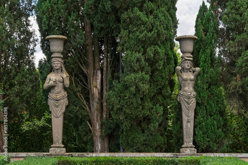 Принти на полотні Italy - Caprarola - Palazzo Farnese - Two caryatid statues holding urns in the f