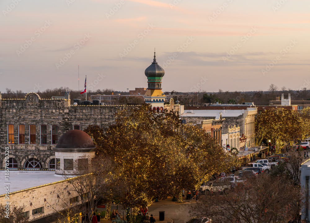 Fototapeta premium Christmas lights surround the Williamson County Old Masonic Lodge in downtown Georgetown in Texas in late December 2025