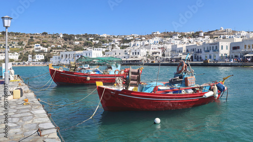Fishing boats tied to the pier in Mykonos Greece