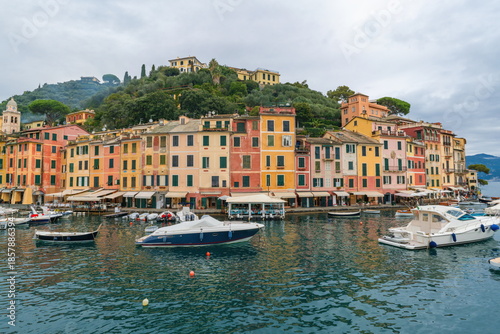 Colorful waterfront buildings and boats in the harbor Portofino, Italy