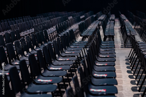 Cuadro en lienzo Rows of black folding chairs arranged for large outdoor event or ceremony